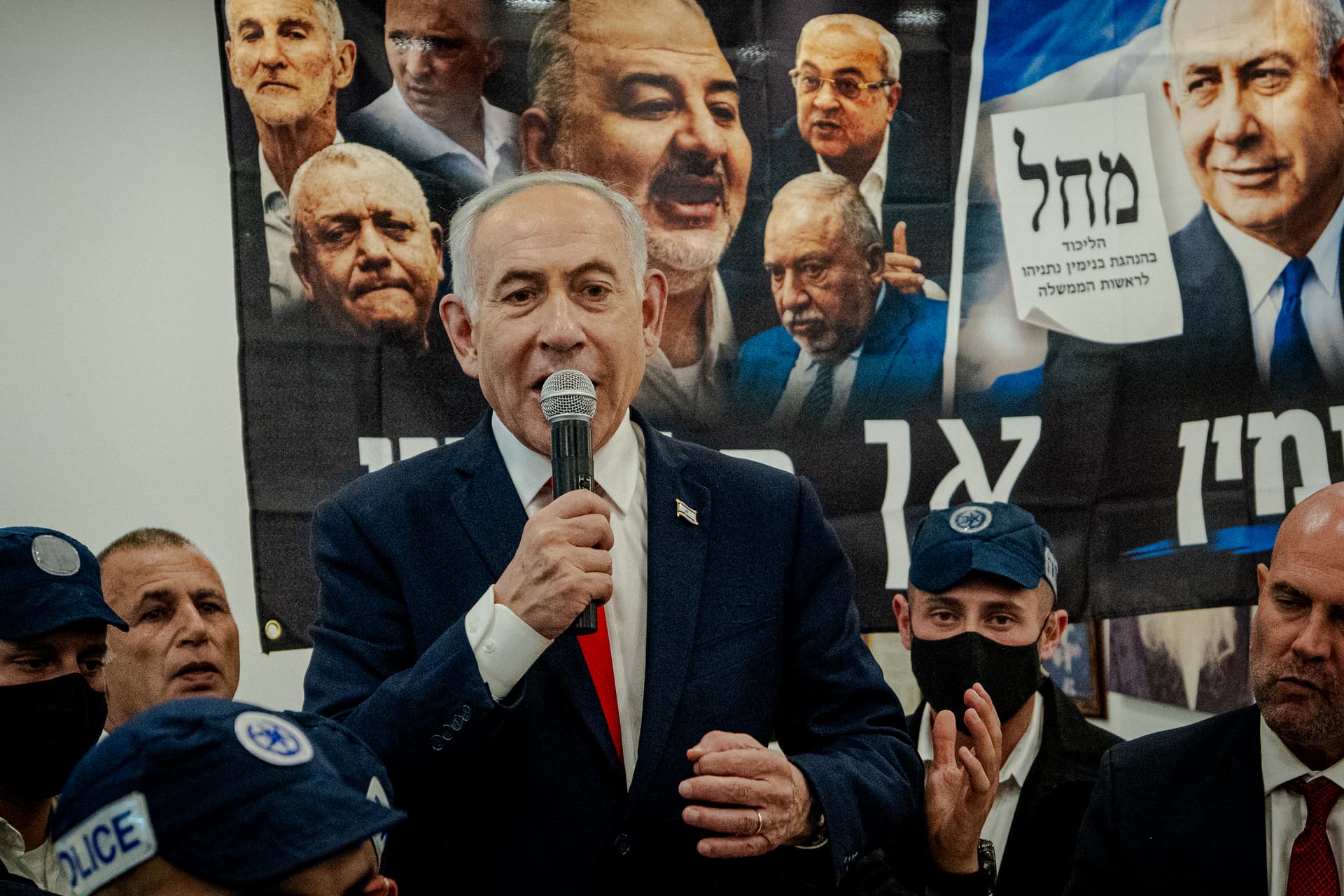 Israeli Prime Minister Benjamin Netanyahu speaks to local residents and supporters during a campaign stop at HaTikva Market.