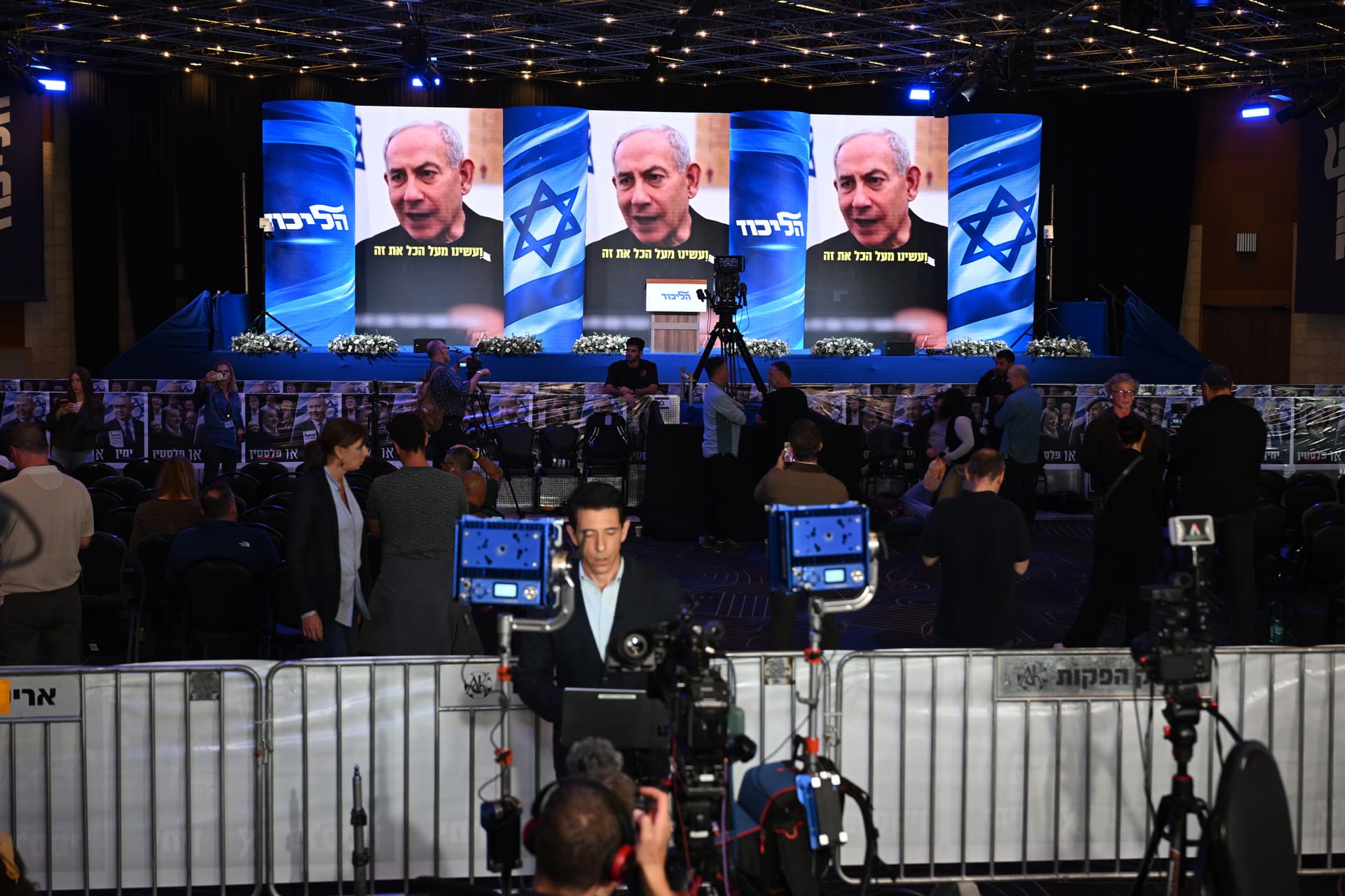 Members of the media working and conducting on camera interviews at the Likud Party election-night event at Teddy Hall, International Convention Center in Jerusalem. 