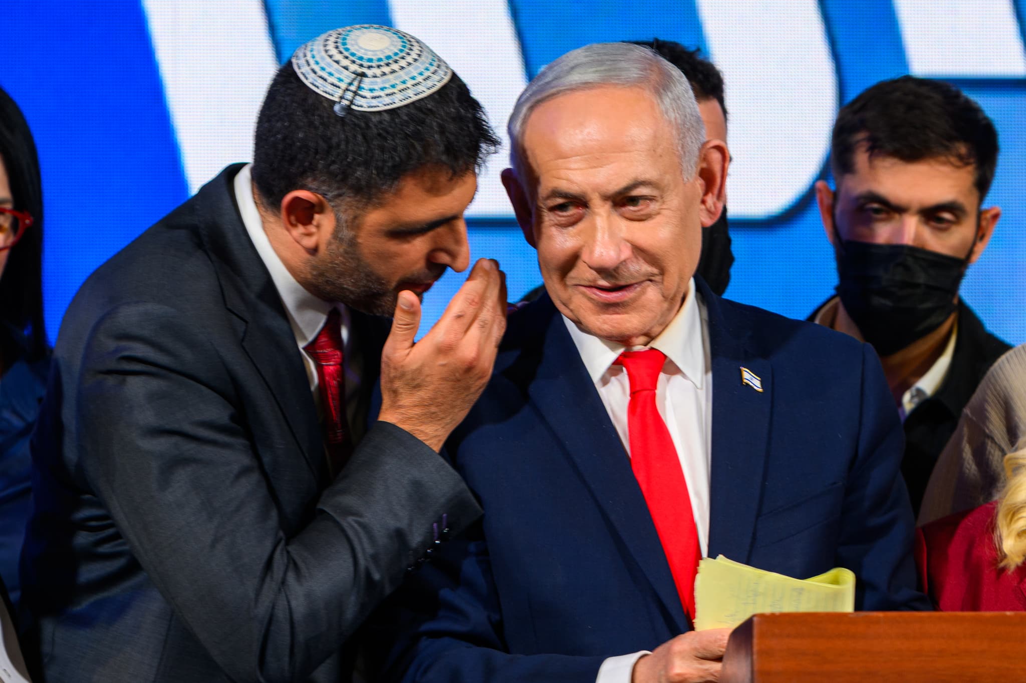 Dr. Shlomo Karhi, Minister of Communications, whispers to Prime Minister and Likud party leader Benjamin Netanyahu at the Likud Party election-night event at the Teddy Hall, International Convention Center on October 28, 2026 at Jerusalem, Israel. 