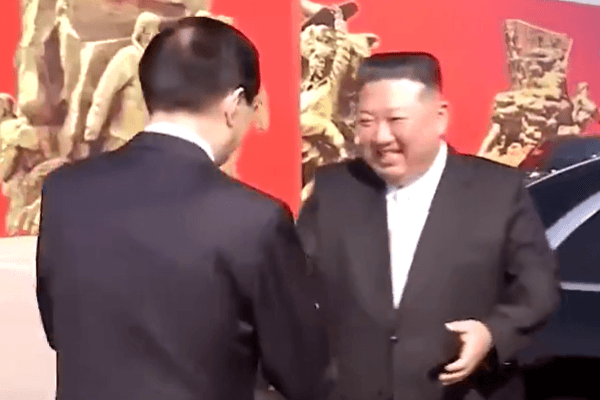 North Korea’s leader, Kim Jong Un, is greeted by Beijing's top political adviser, Wang Huning, at the start of a surprise one-day visit to Communist China.