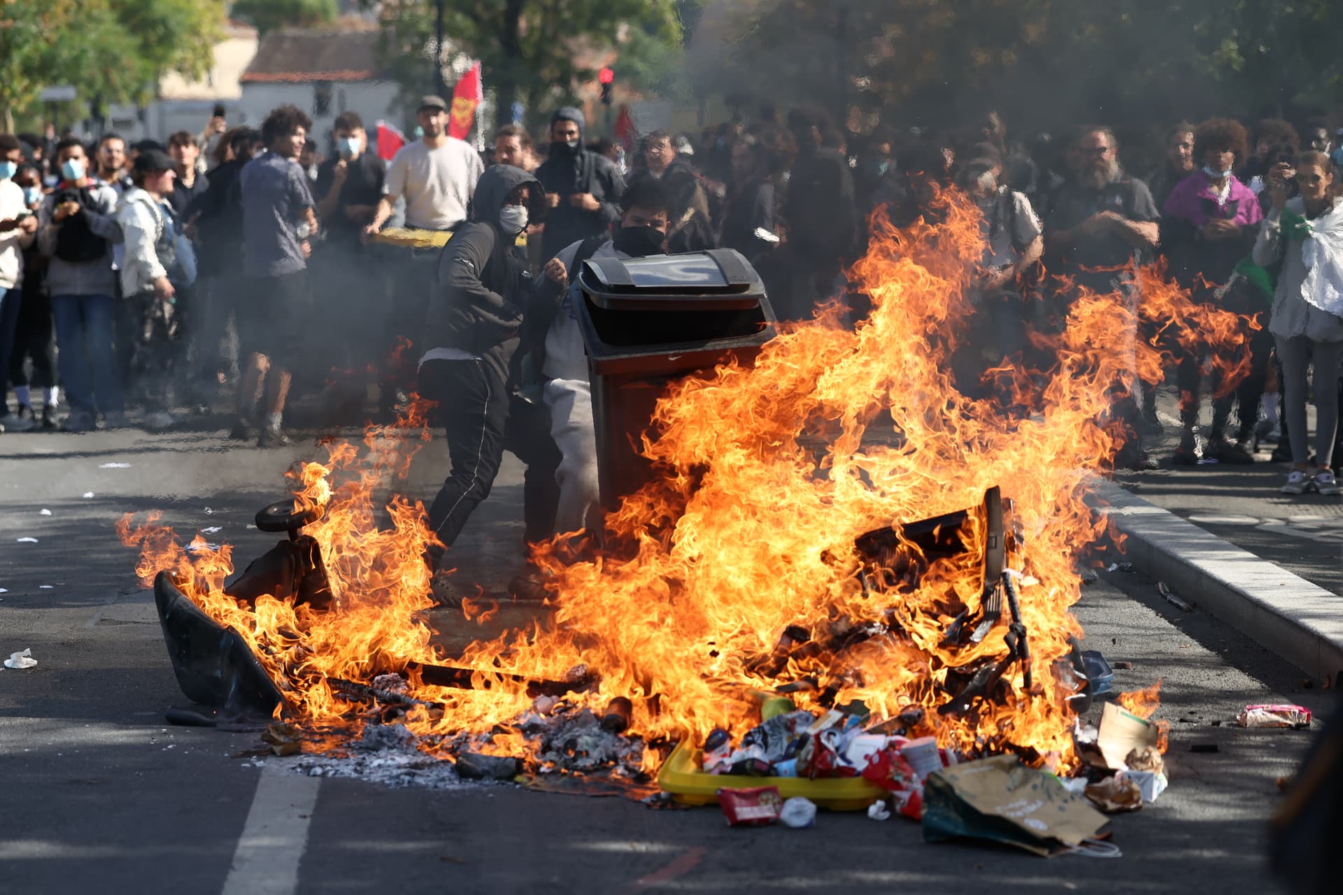 French students set fires as they clash with police during a march through the streets on October 1, 2026 at Aubervilliers, a northern suburb of Paris.