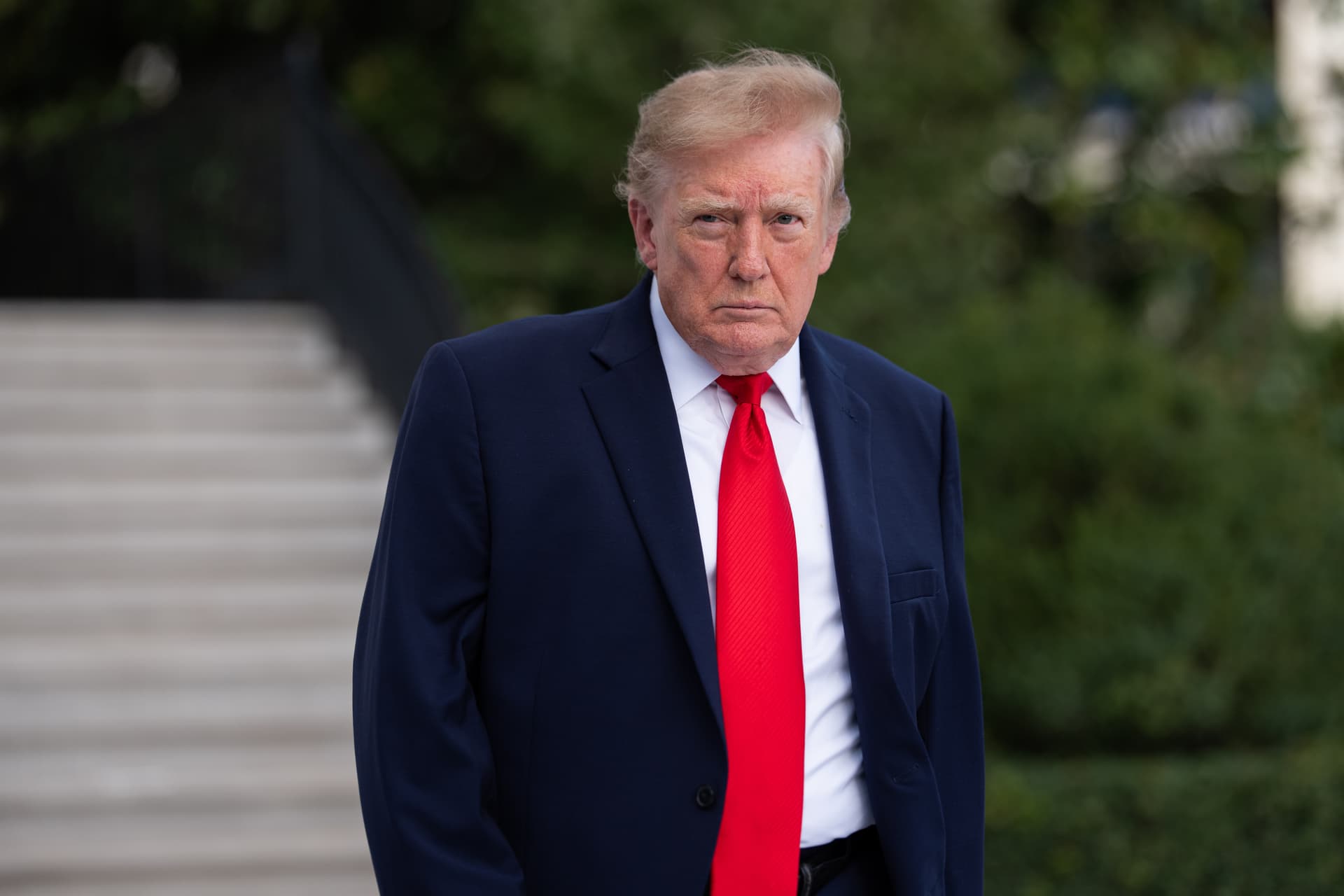 President Trump walks on the South Lawn as he departs the White House on October 12, 2026.