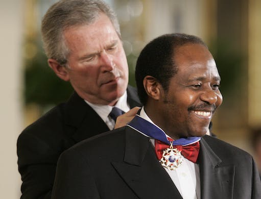 Paul Rusesabagina receives the Presidential Medal of Freedom Award from President Bush in the East Room of the White House November 9, 2005. AP/Lawrence Jackson, file