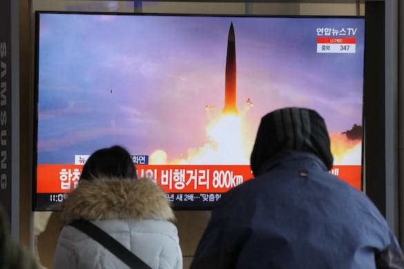 At the Seoul Railway Station, people watch file footage of a North Korean missile launch January 30, 2022. AP/Ahn Young-joon