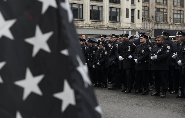 Police officers line up in New York City for Officer Wilbert Mora's funeral, February 2, 2022. AP/Yuki Iwamura
