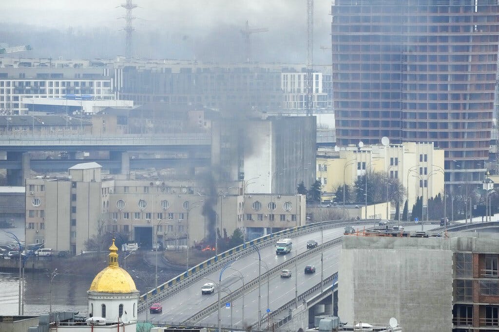 Smoke rises near a military building after an apparent Russian strike at Kyiv, February 24, 2022. AP/Efrem Lukatsky