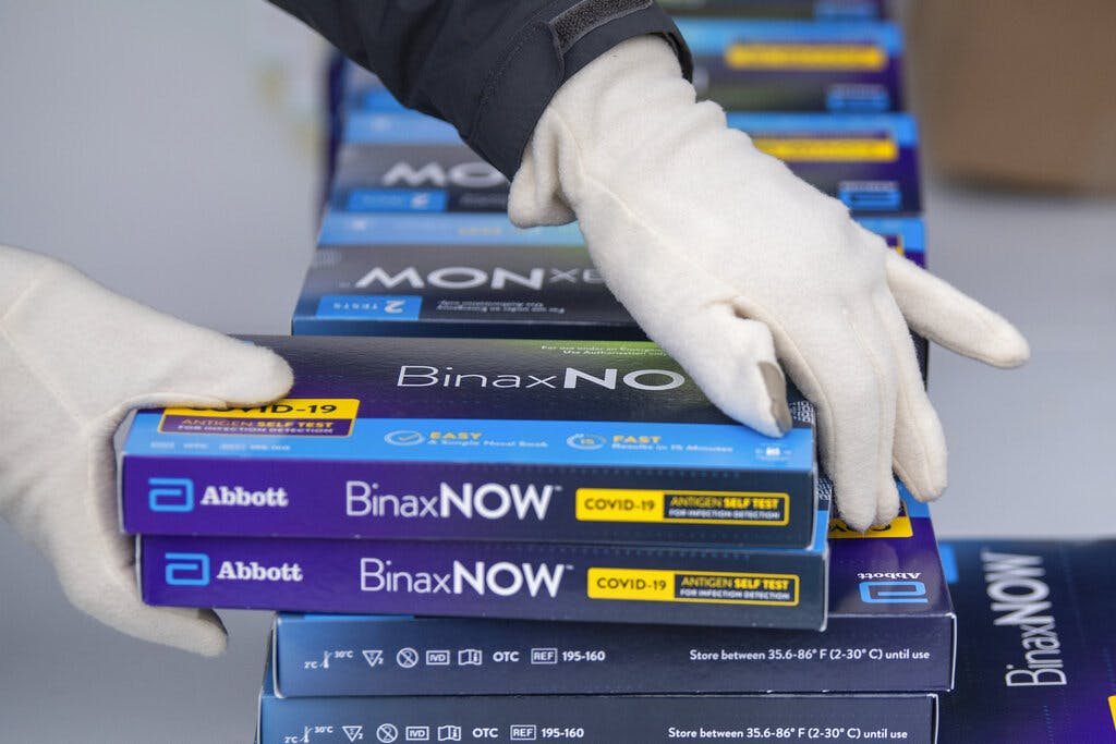 At-home COVID-19 test kits at a distribution event, at Youngstown, Ohio. AP Photo/David Dermer, File