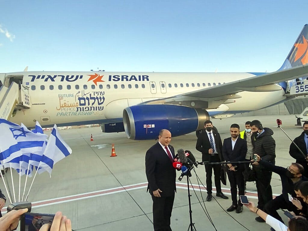 File photo of Prime Minister Bennett on the tarmac at Ben Gurion Airport February 14, 2022. AP/Ilan Ben Zion