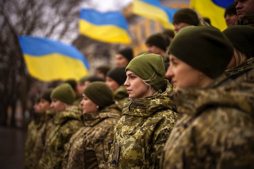 Ukrainian Army soldiers gather to celebrate a Day of Unity on February 16, 2022. AP Photo/Emilio Morenatti