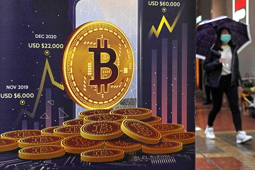 An advertisement for Bitcoin cryptocurrency. AP/Kin Cheung, file