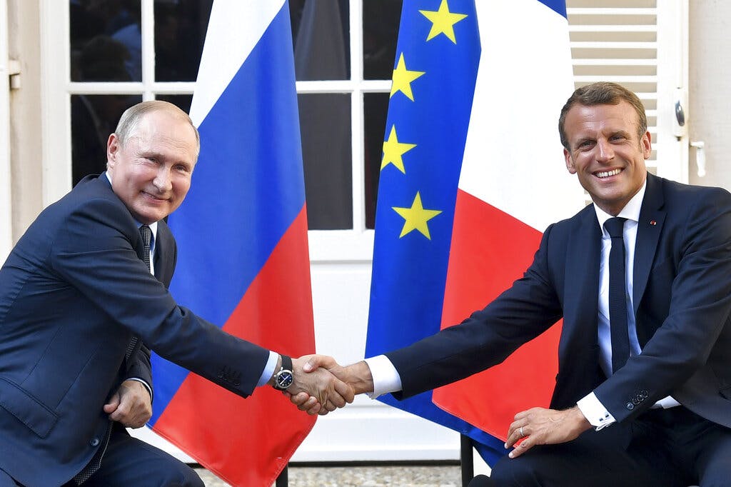 Presidents Putin and Macron in 2019. Gerard Julien, pool via AP, file