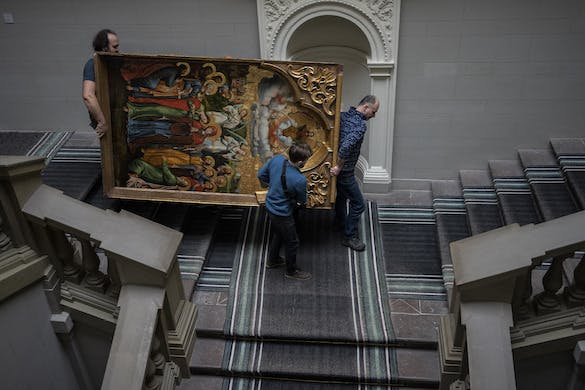 In Lviv, employees move artwork at the Andrey Sheptytsky National Museum March 4, 2022 as part of safety preparations in the event of an attack. AP/Bernat Armangue