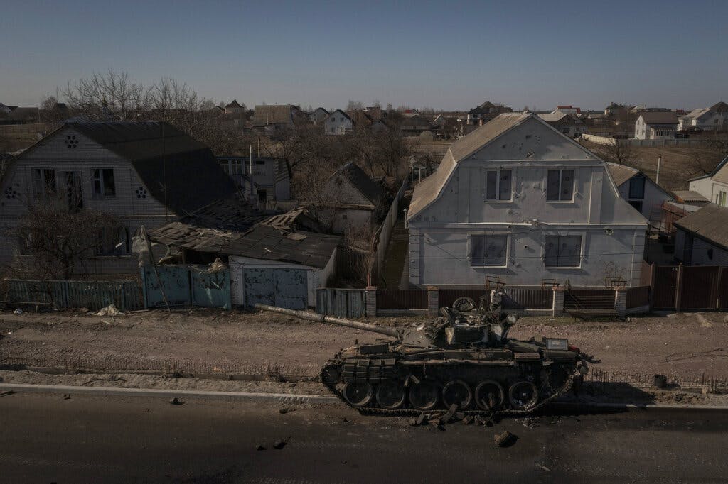 A destroyed tank after battles between Ukrainian and Russian forces on a main road near Brovary, north of Kiev, March 10, 2022. AP/Felipe Dana