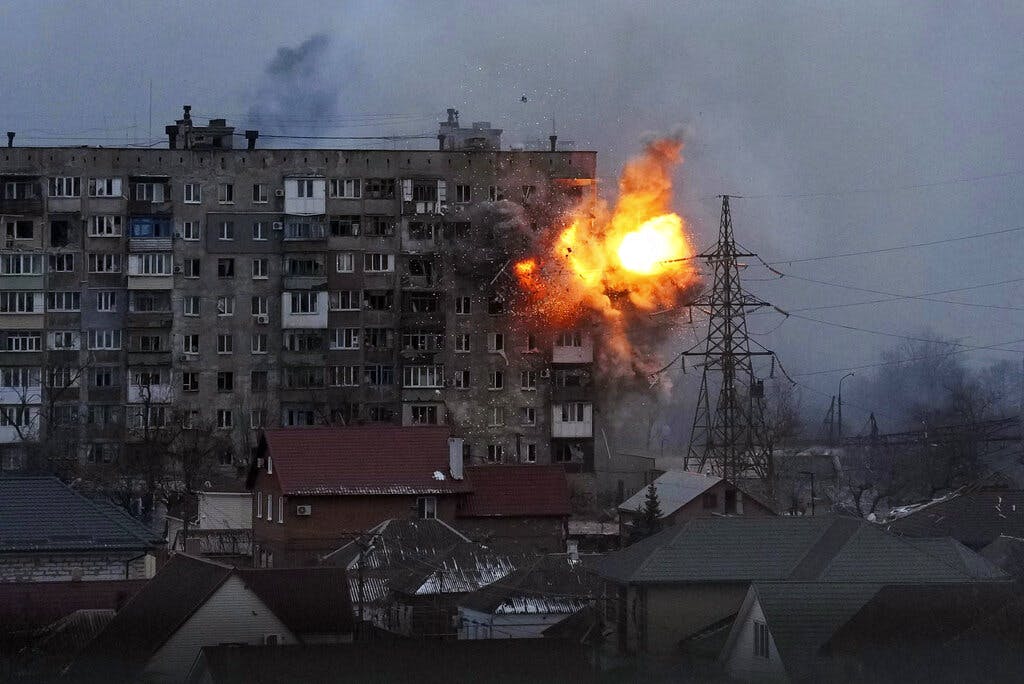 An apartment building is attacked by a Russian tank at Mariupol March 11, 2022. AP/Evgeniy Maloletka