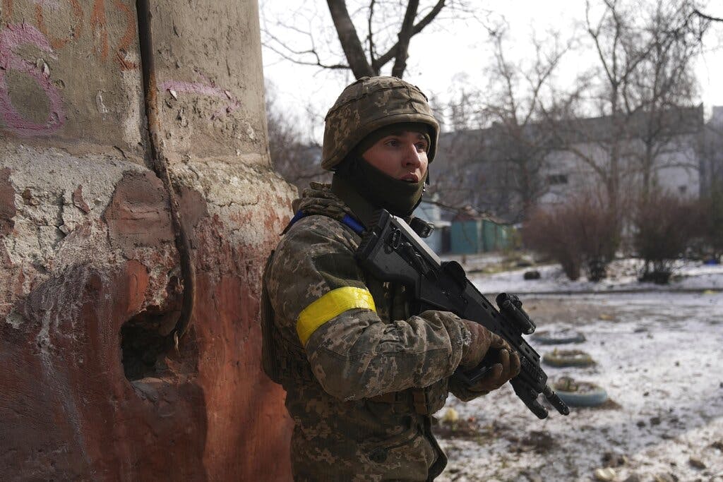 A Ukrainian serviceman guards his position at Mariupol, Ukraine, March 12, 2022. AP/Evgeniy Maloletka