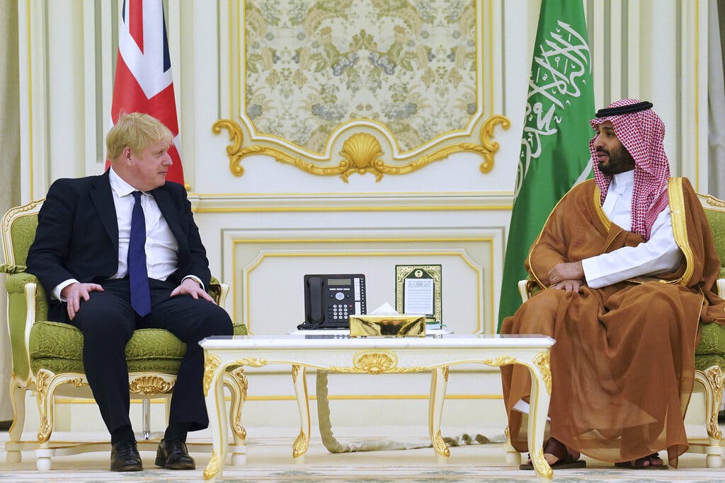 Mohammed bin Salman, right, crown prince of Saudi Arabia, meets with Prime Minister Johnson March 16, 2022. Stefan Rousseau/pool via AP