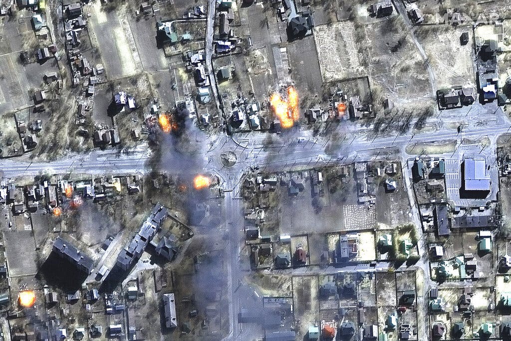 A satellite image shows burning buildings in a residential area in northeast Chernihiv, Ukraine, March 16, 2022. Maxar Technologies via AP