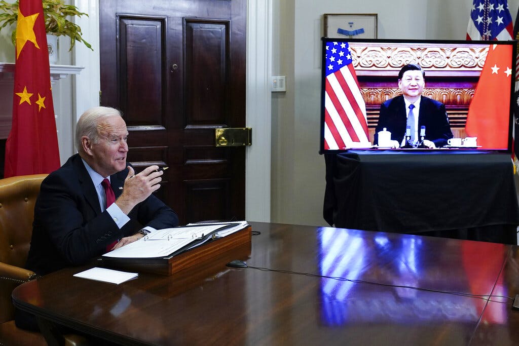 Presidents Biden and Xi meet virtually on November 15, 2021.  AP Photo/Susan Walsh, file