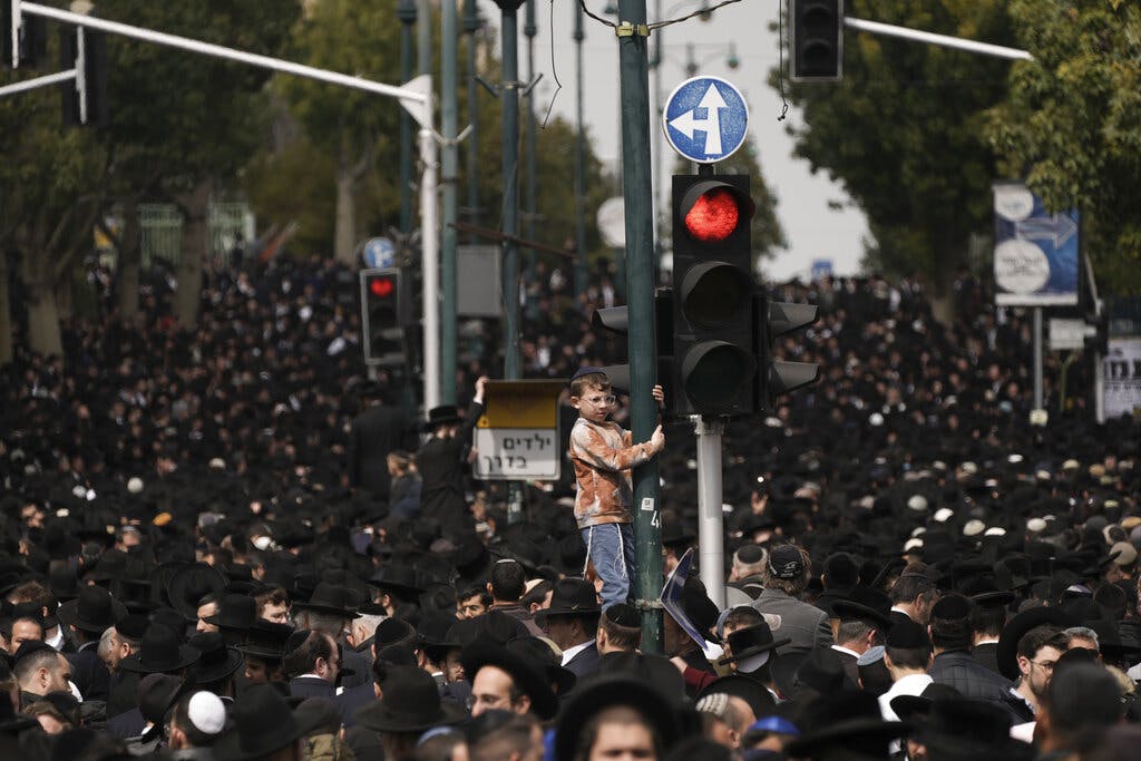 Ultra-Orthodox Jews attend the funeral of Rabbi Chaim Kanievsky at Bnei Brak, Israel, March 20, 2022. AP/Oded Balilty