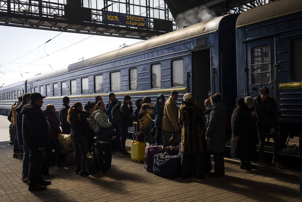 Ukrainians at the Lviv train station platform March 20, 2022. AP/Bernat Armangue