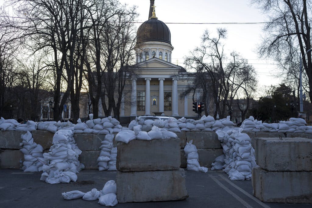 Concrete blocks topped with sandbags block a street near the Preobrazhensky Cathedral at Odessa March 22, 2022. AP/Petros Giannakouris