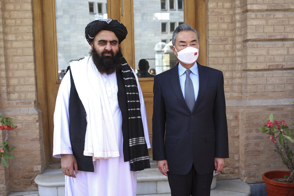 The Chinese foreign minister, Wang Yi, right, with the acting foreign minister of the Afghan Taliban's caretaker government, Amir Khan Muttaqi, at Kabul March 24, 2022. Saifurahman Safi/Xinhua via AP