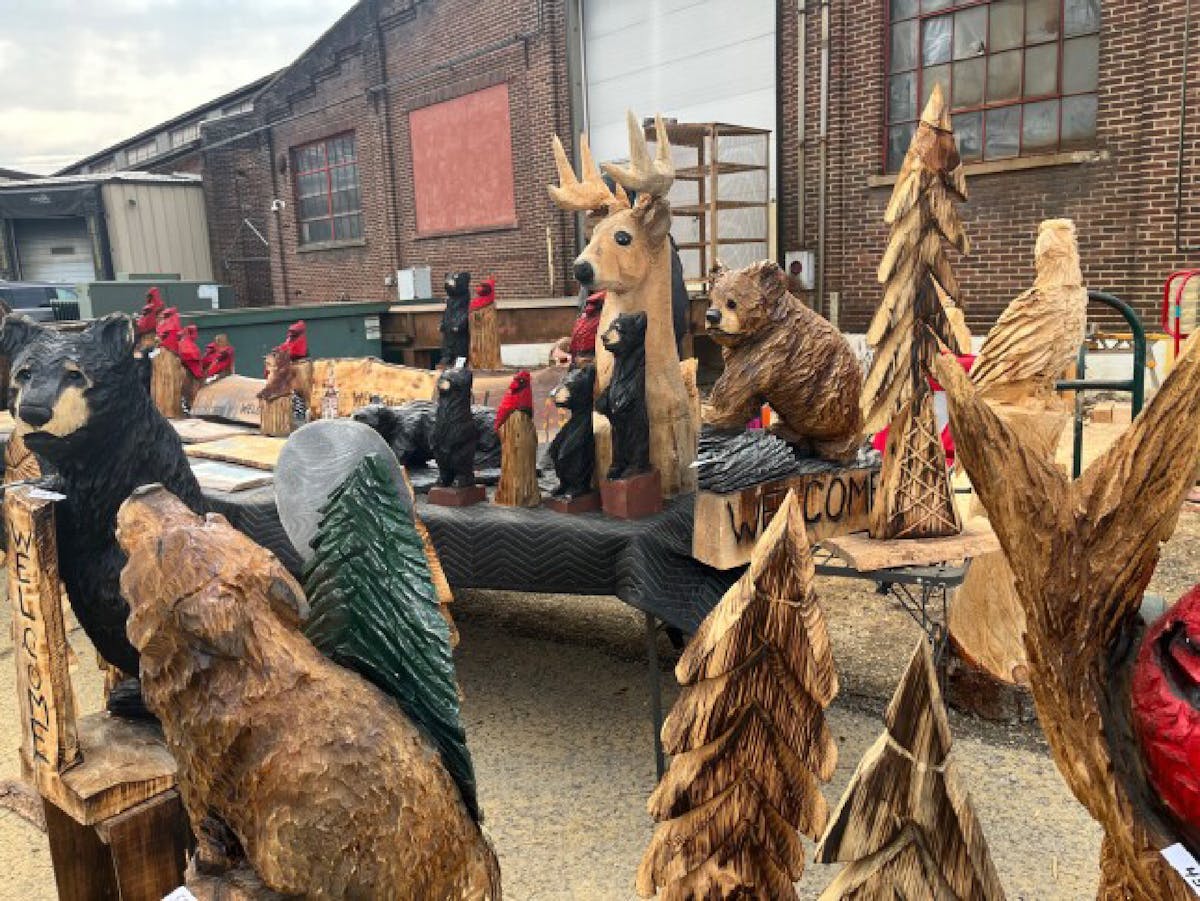Several chainsaw craftsmen and artisans displayed their work outside the old tannery at Mountain Fest at Ridgway, Pennsylvania. Salena Zito