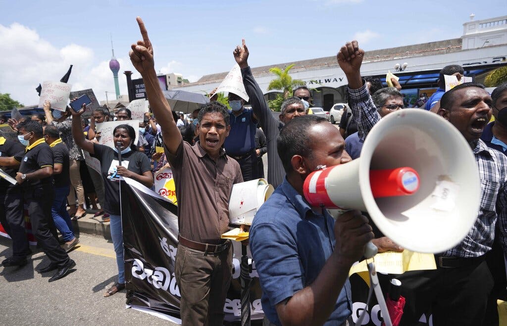 Sri Lankans during a protest at Colombo April 20, 2022. AP/Eranga Jayawardena
