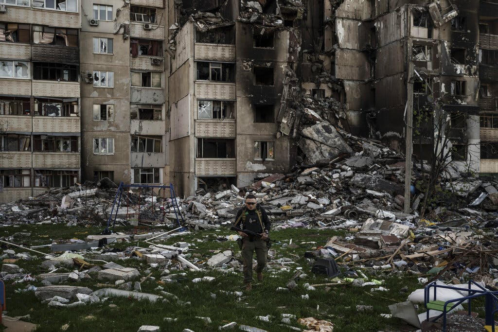 A Ukrainian serviceman walks amid the rubble of a building after multiple Russian bombardments at Kharkiv April 25, 2022. AP/Felipe Dana
