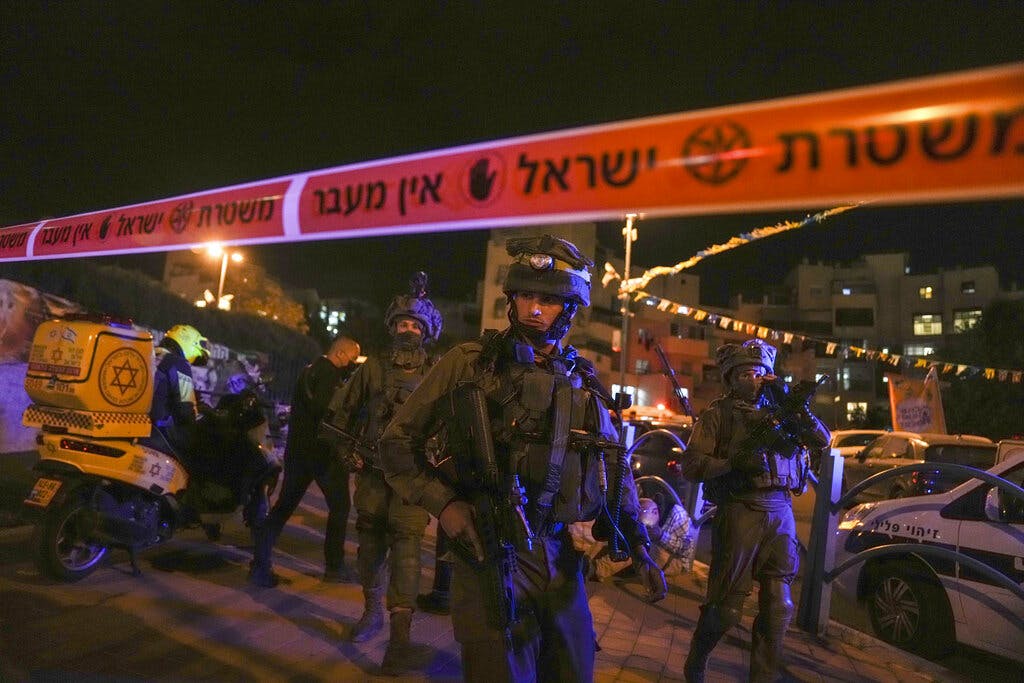 Israeli forces secure the area of a stabbing attack in the town of Elad, Israel, May 5, 2022. AP/Maya Alleruzzo