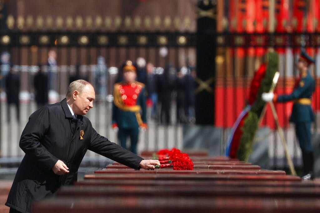 Vladimir Putin attends a wreath-laying ceremony at Moscow May 9, 2022. Anton Novoderezhkin, Sputnik, Kremlin pool photo via AP