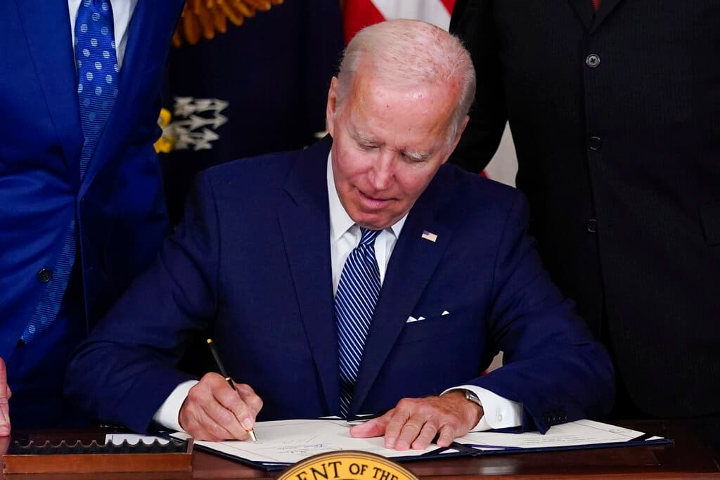 AP/Susan Walsh President Biden signs the Democrats' bill in the State Dining Room of the White House August 16, 2022.