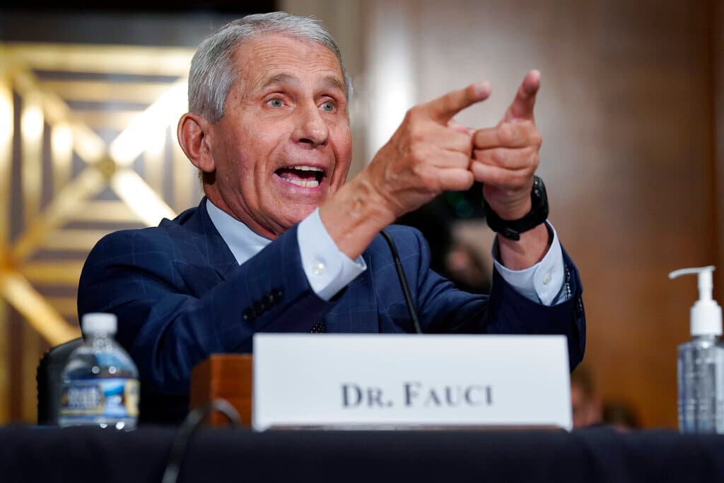 AP/J. Scott Applewhite, pool Dr. Anthony Fauci responds to accusations by Senator Paul as he testifies before the Senate Health, Education, Labor, and Pensions Committee about the origin of Covid-19, July 20, 2021.