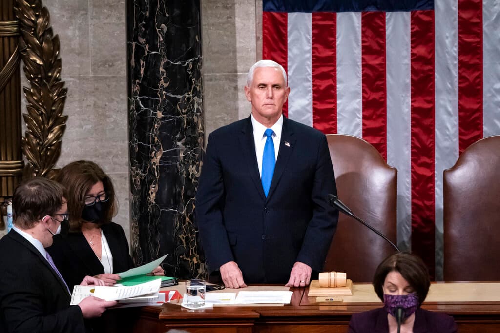 AP/J. Scott Applewhite, file Vice President Pence returned to the House chamber after midnight, January 7, 2021, to finish the work of the Electoral College after the attack on the Capitol.