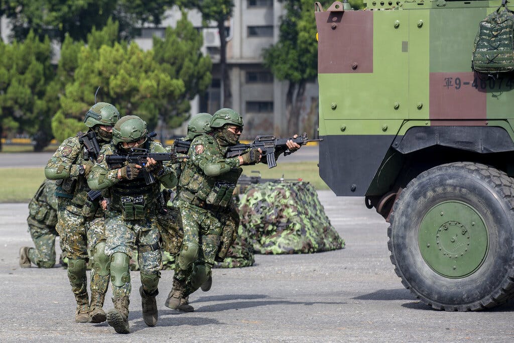 Soldiers take part in a drill during a visit by Taiwan's president, Tsai Ing-wen, at a military base at Chiayi in southwestern Taiwan, January 6, 2023. 