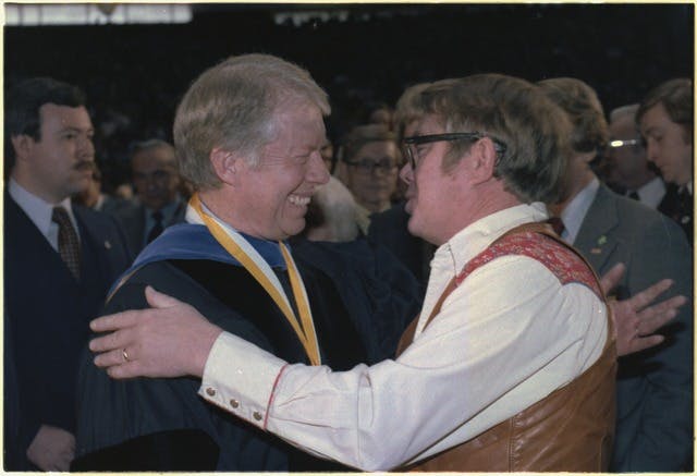 President Carter greets his brother, Billy Carter, at the Georgia Institute of Technology at Atlanta on February 20, 1979.
