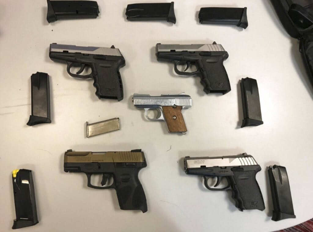 Semi-automatic handguns seized in undercover transactions at Brooklyn, New York.