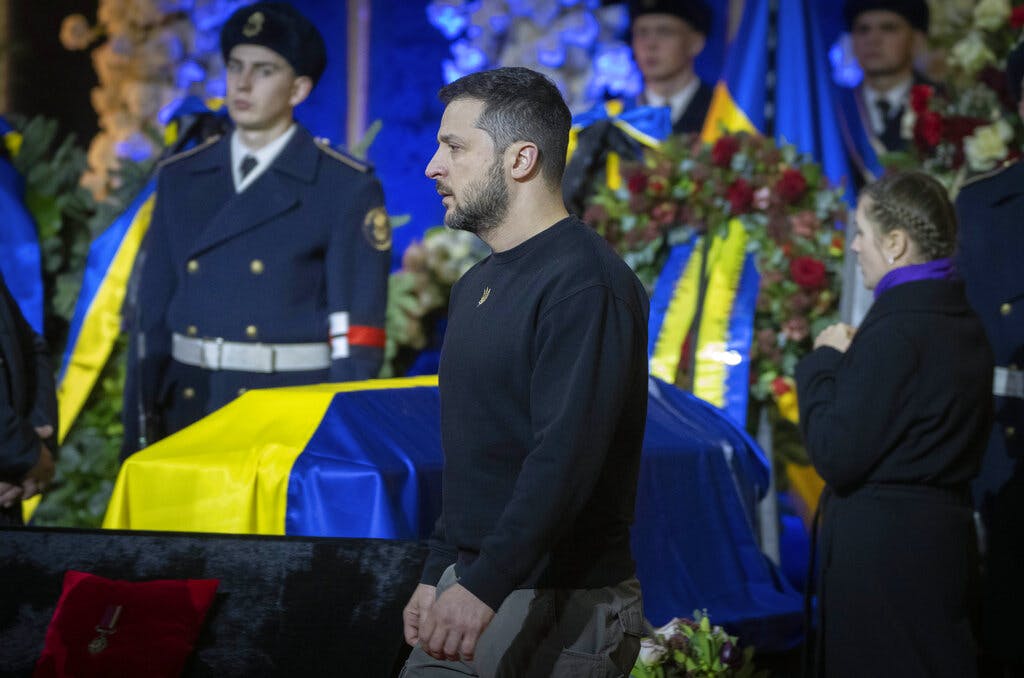 President Zelensky pays his respects to victims of a deadly helicopter crash during a farewell ceremony at Kyiv, January 21, 2023. 