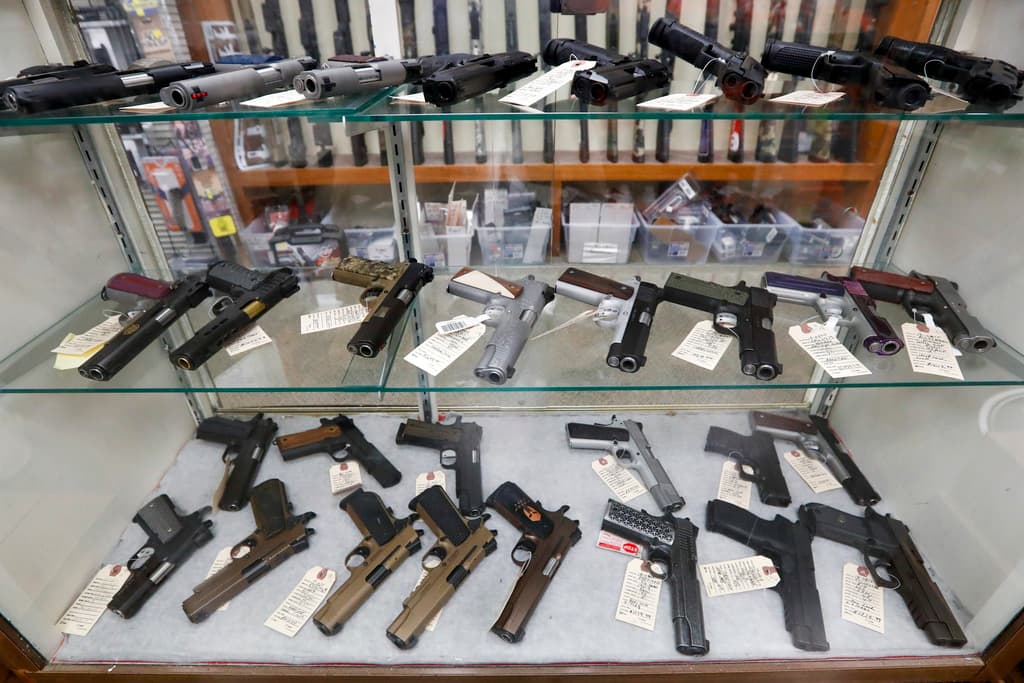 AP/Keith Srakocic A display of semi-automatic handguns.