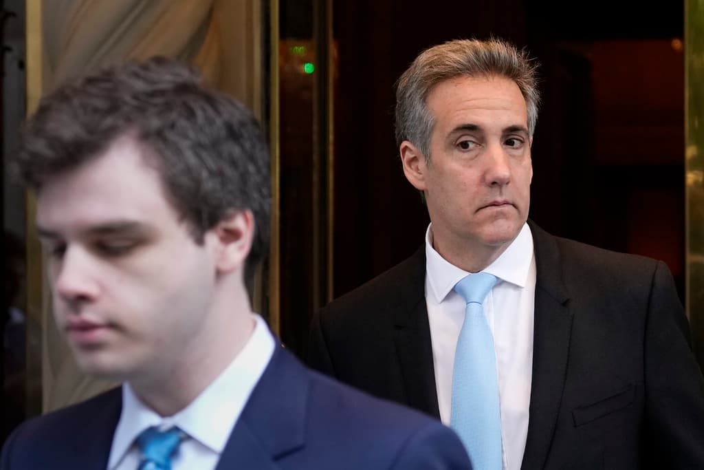 AP/Seth Wenig Michael Cohen, right, leaves his apartment building in New York, May 14, 2024.