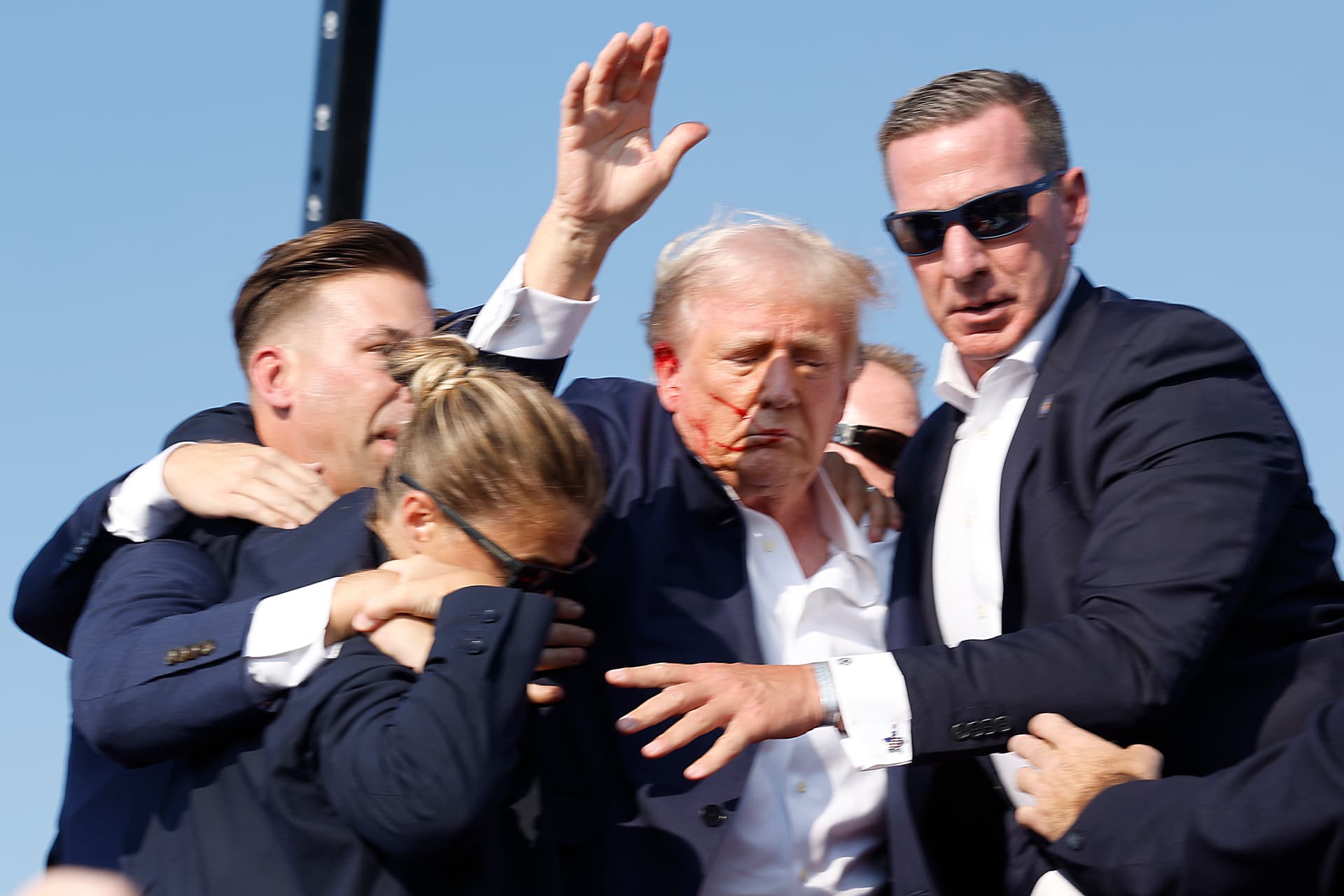 Anna Moneymaker/Getty Images Then-candidate Donald Trump is rushed offstage during a rally on July 13, 2024, at Butler, Pennsylvania.