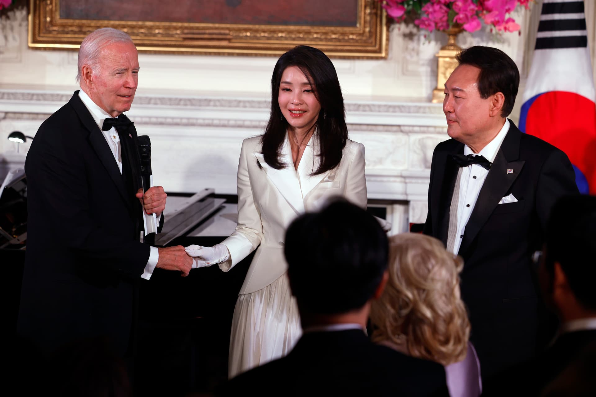 Chip Somodevilla/Getty Images President Biden, South Korea's former first lady, Kim Keon-hee, and former President Yoon Suk-yeol during a state dinner at the White House, April 26, 2023, at Washington, D.C.
