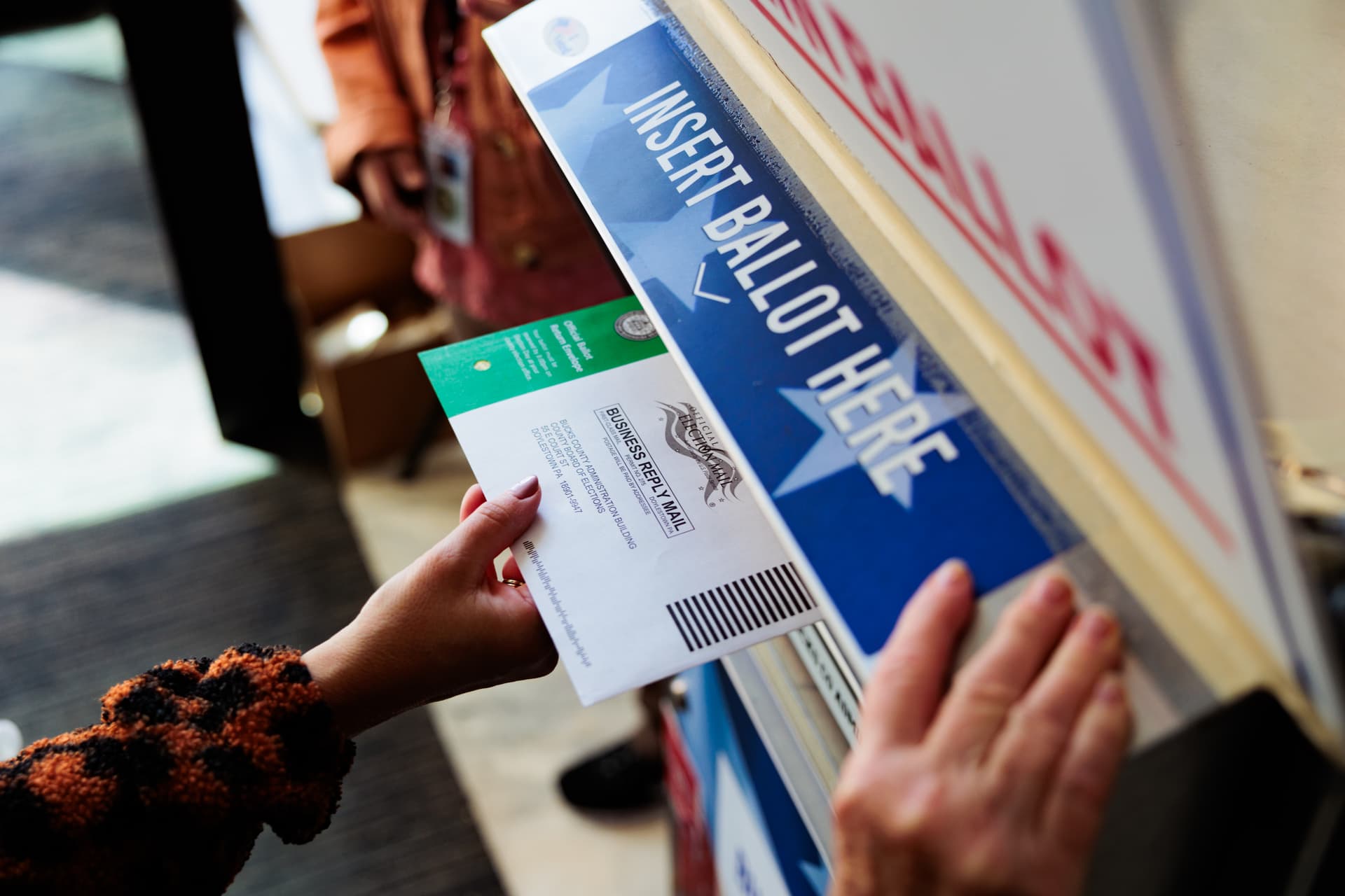 Photo by Hannah Beier/Getty Images A person drops off a mail-in ballot on October 15, 2024, at Doylestown, Pennsylvania. Registered voters in Pennsylvania can vote "On Demand" by requesting, a mail-in or absentee ballot filing it out and dropping it off all in one visit to their county election office or other designated location.