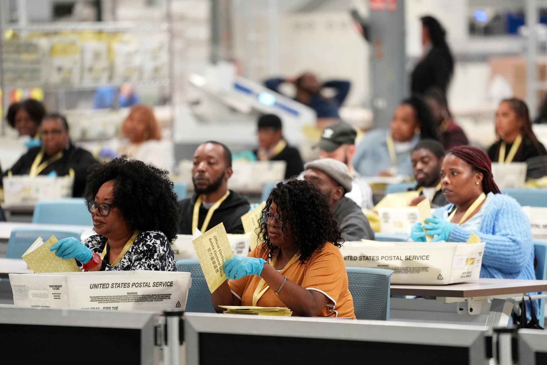 AP/Matt Rourke Election staffers process mail-in ballots for the 2024 General Election at the Philadelphia Election Warehouse.