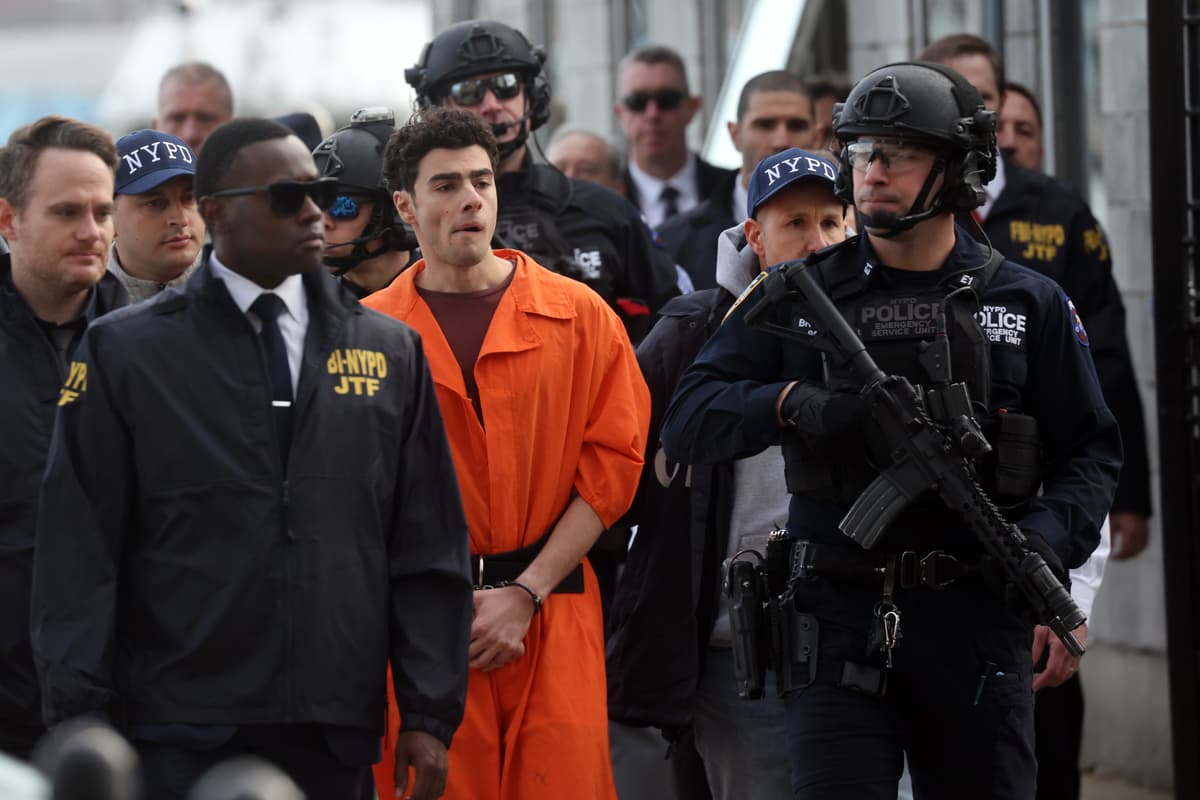 Spencer Platt/Getty Images Luigi Mangione, the suspect in the killing of UnitedHealthcare CEO Brian Thompson, arrives at a heliport with members of the New York Police Department on December 19, 2024, at New York City.