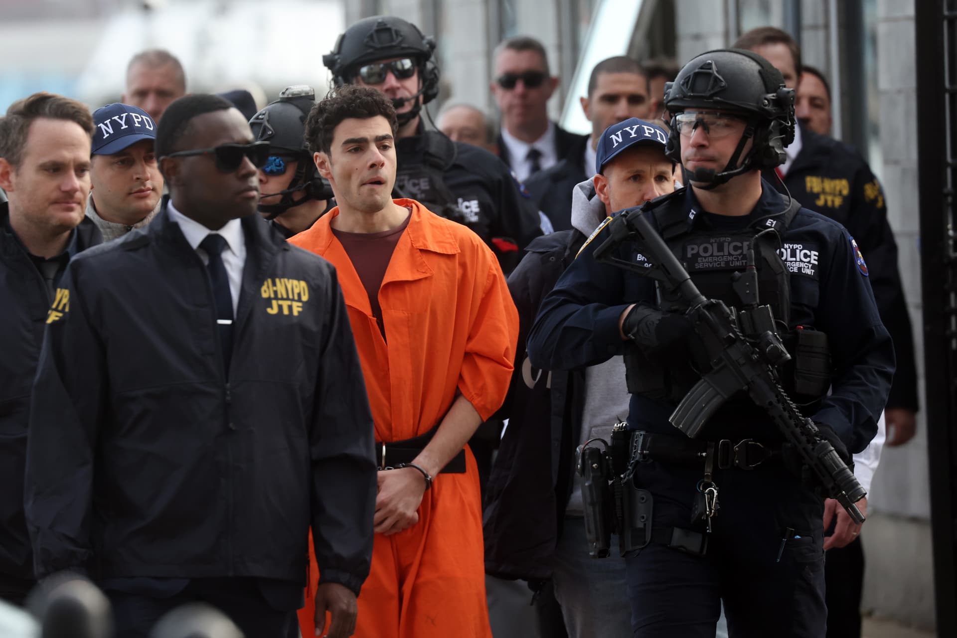 Spencer Platt/Getty Images Luigi Mangione, the suspect in the killing of UnitedHealthcare CEO Brian Thompson, arrives at a heliport with members of the New York Police Department on December 19, 2024, at New York City.