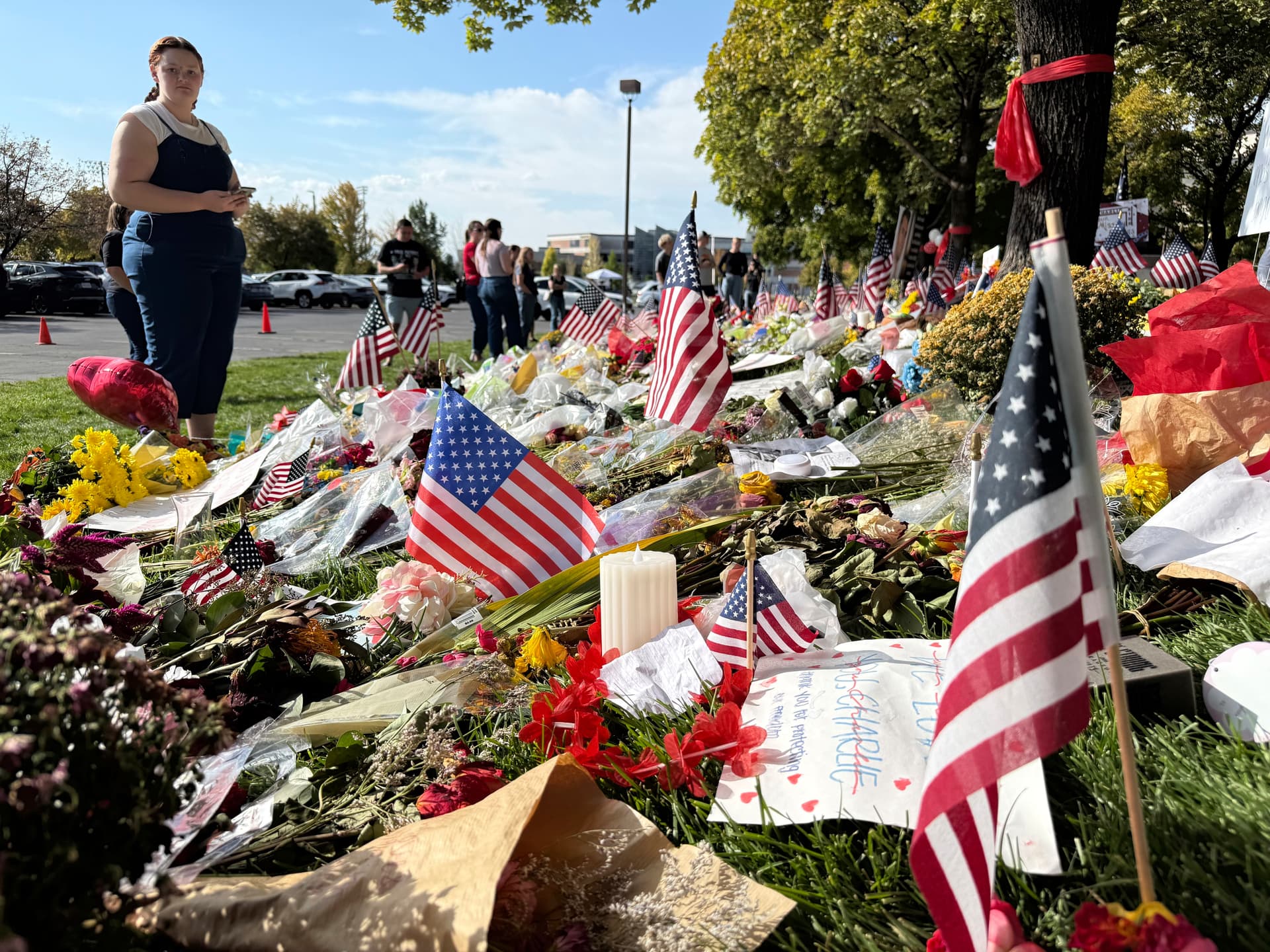 Jesse Bedayn/AP American flags and flowers are displayed at a memorial for Charlie Kirk at Utah Valley University at Orem, Utah, on September 15, 2025.