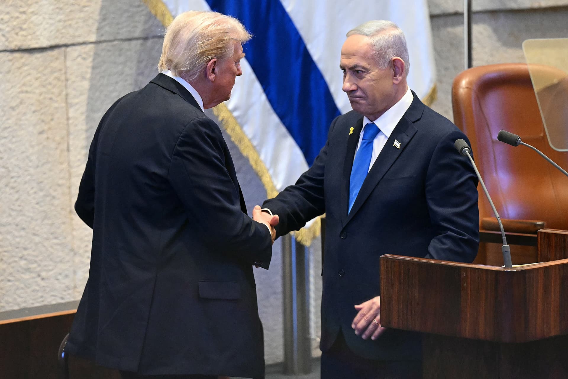 Saul Loeb/Pool via AP President Trump shakes hands with Prime Minister Benjamin Netanyahu at the Knesset, October 13, 2025, at Jerusalem.