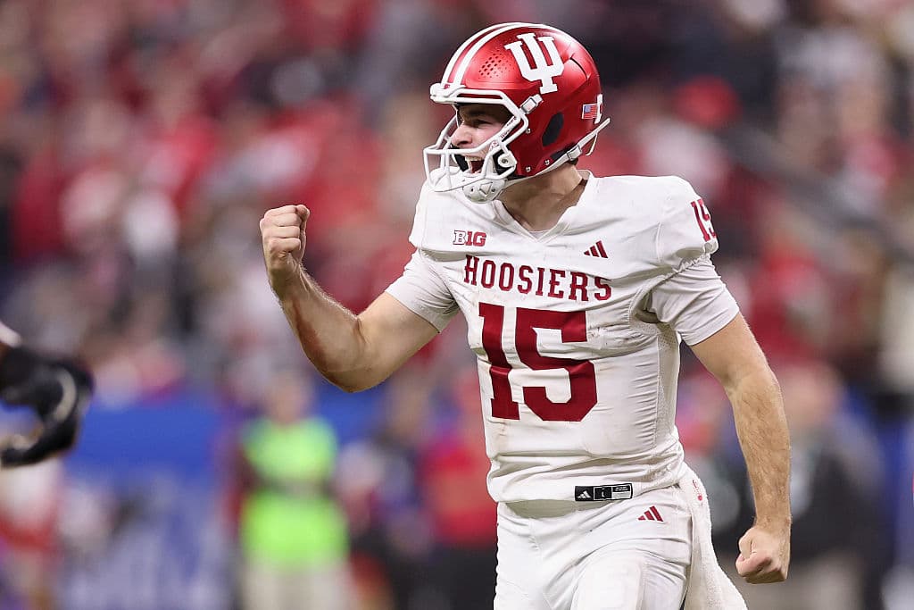 Michael Reaves/Getty Images Fernando Mendoza of the Indiana Hoosiers celebrates a touchdown against the Ohio State Buckeyes during the third quarter in the 2025 Big Ten Football Championship on December 6, 2025 at Indianapolis.
