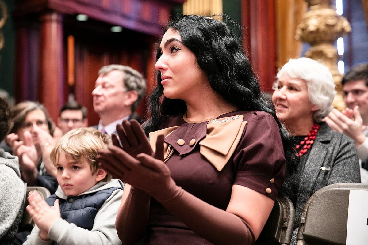 Governor Tom Wolf via CC 2.0 https://creativecommons.org/licenses/by/2.0/deed.en Gisele Fetterman watches during the 2019 inauguration of Governor Tom Wolf and her husband, Lieutenant Governor John Fetterman.
